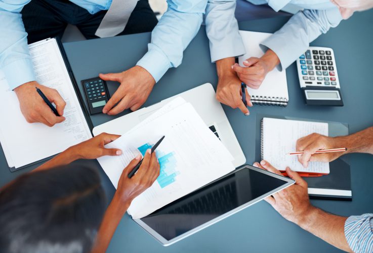 Cropped image of hands of businesspeople working together on business project at office - Consulting